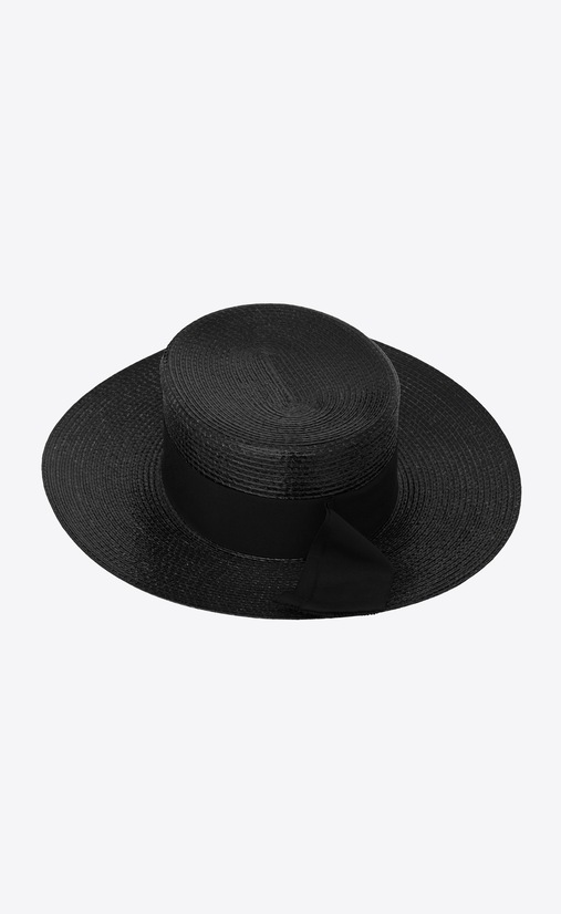 Large boater hat in varnished straw